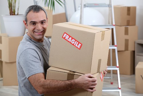 Moving boxes and a removal team preparing for a Richmond relocation
