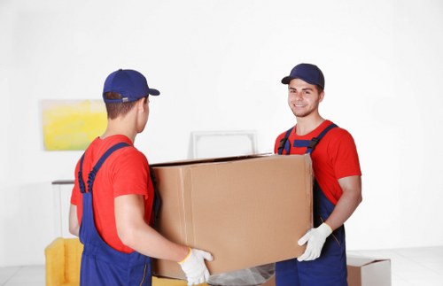 Removal team preparing a Richmond house move with boxes and furniture