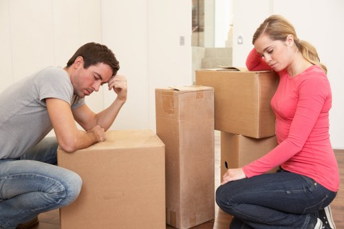 Removal team loading goods into a vehicle during a house move