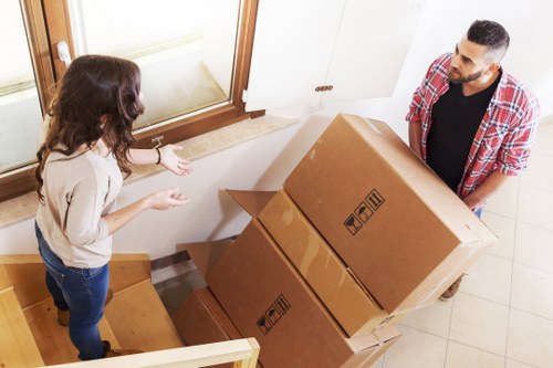 Packed office boxes and furniture ready for relocation