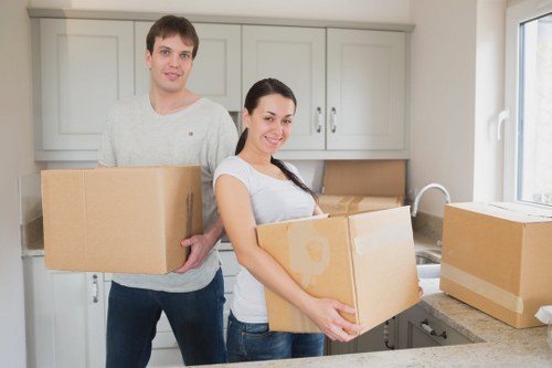 Professional movers carefully handling furniture during a Richmond house relocation